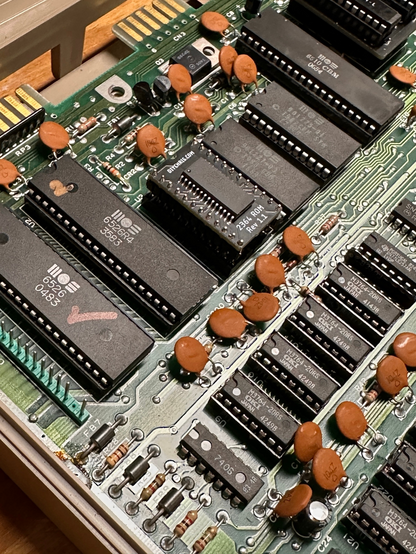 The beautiful innards of the c64 with a new replacement BASIC ROM chip.